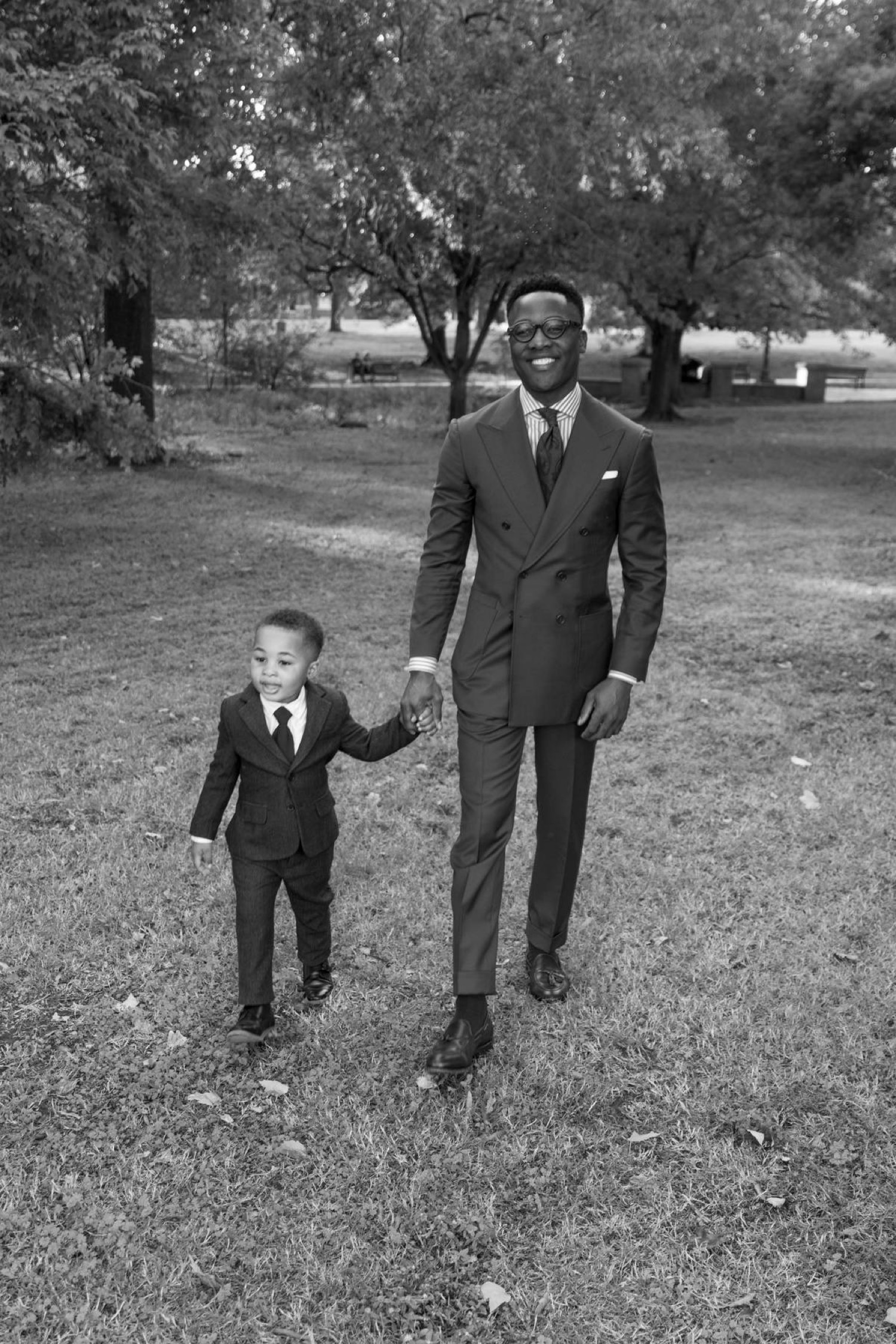 Pastor JL Jones walking hand in hand with Greyson