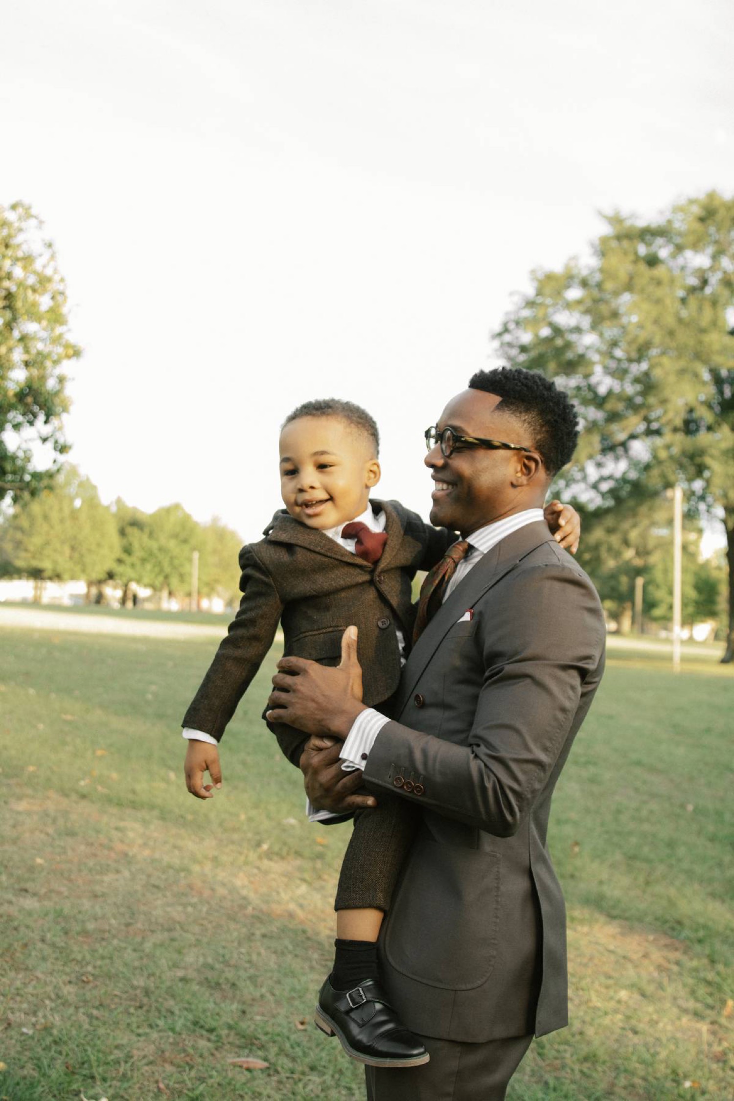 Pastor JL Jones holding his son Greyson